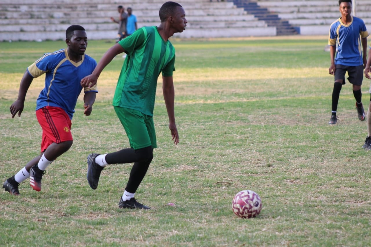 Two players competing for the ball